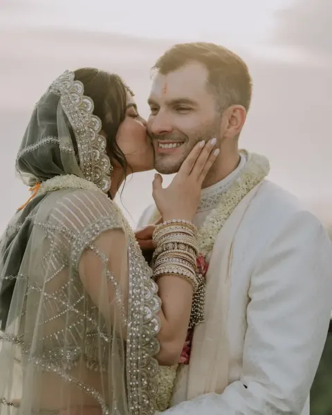 A bride kissing her groom on their wedding day in Bali