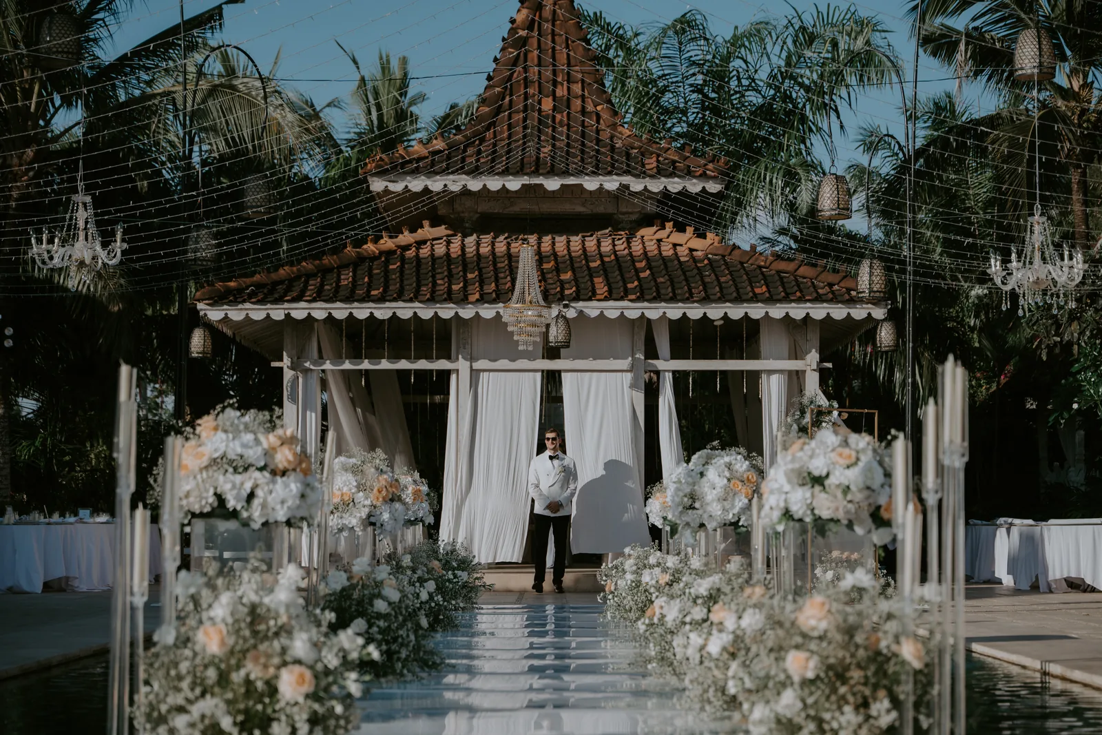 The joglo pavilion at Villa Plenilunio dressed with drapes and florals for a ceremony